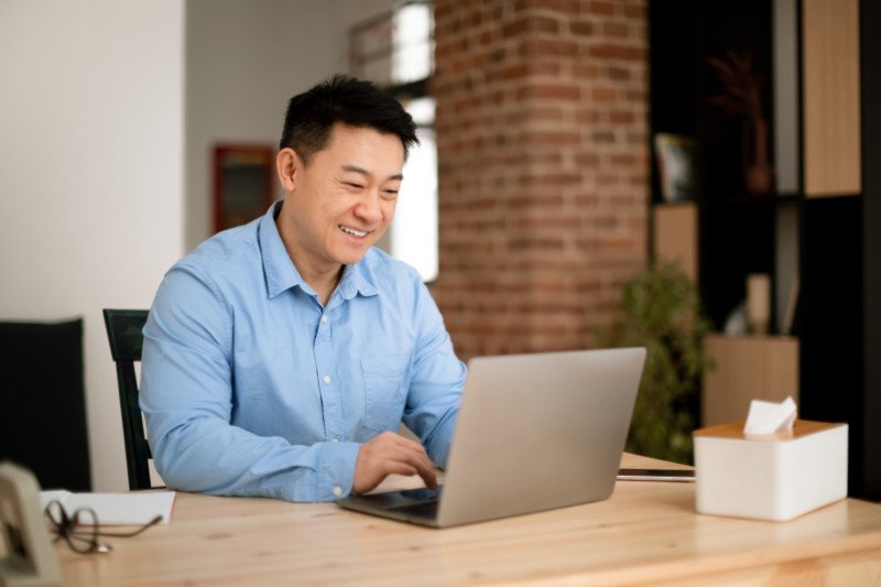 positive asian middle aged male entrepreneur worki 2026 01 08 23 10 21 utc